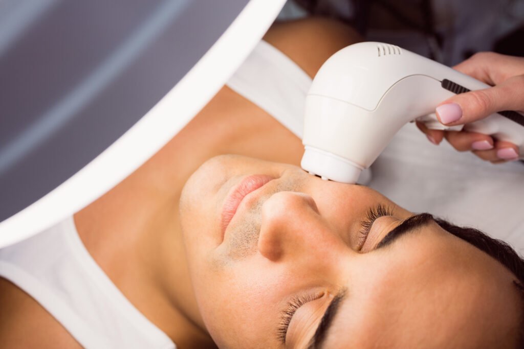 ultraformer Doctor performing laser hair removal on patient face in clinic